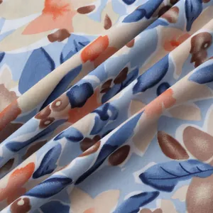 Detailed close-up view showing the soft texture and floral pattern of beach shirt fabric