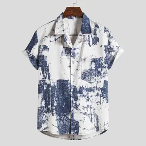 Close-up detail of retro Hawaiian abstract blue print on men's casual short sleeve shirt