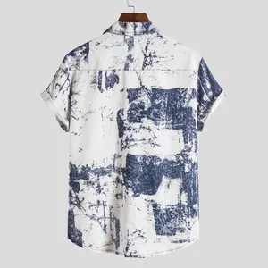 Back view of men's vintage Hawaiian short sleeve shirt with blue abstract print.