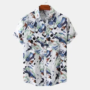 Close-up detail of a men's short-sleeve summer shirt featuring an abstract artistic print