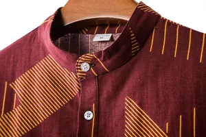 Close-up detail of maroon men's linen shirt with yellow geometric stripe patterns