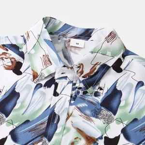 Detailed close-up of a men's shirt collar with vibrant abstract artistic prints
