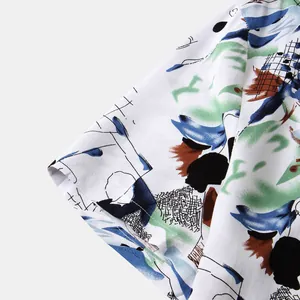 Detailed macro shot showing the fabric texture and sleeve cuff of a men's abstract floral shirt
