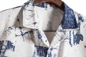 Close-up of retro Hawaiian print shirt collar showing blue tie-dye pattern detail