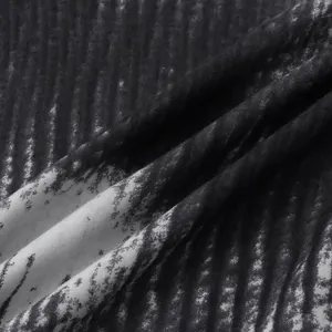 Macro view showing the soft texture and black and white print of a Hawaiian shirt