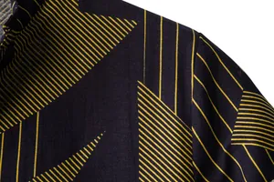 Close-up of dark blue linen-like shirt fabric featuring a yellow geometric stripe pattern