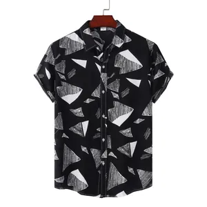 Detail view of men's short sleeve Hawaiian shirt with black and white abstract print
