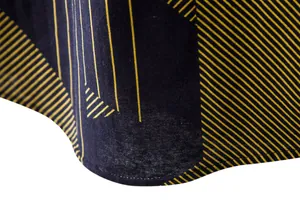 Detailed macro view of men's cotton-linen shirt with yellow geometric stripe pattern