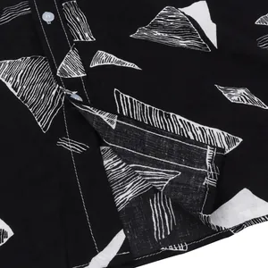 Close-up of black and white geometric pattern on men's Hawaiian beach shirt fabric.