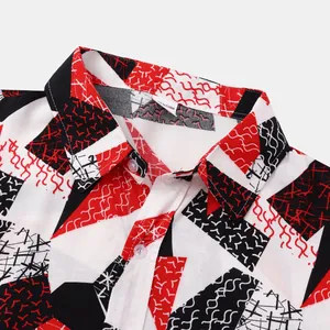 Close-up detail of a men's short-sleeved shirt with red and black geometric patterns
