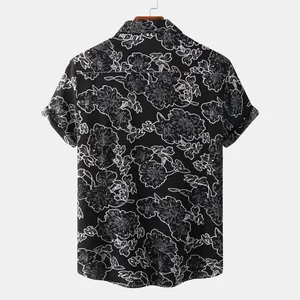 Back view of a men's short-sleeve shirt featuring a white floral outline on black