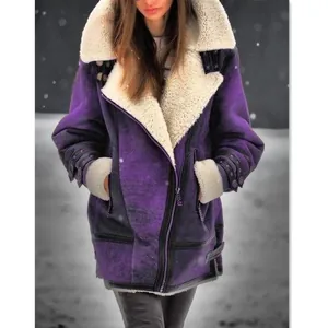 Close-up of the thick faux shearling collar and textured purple suede material