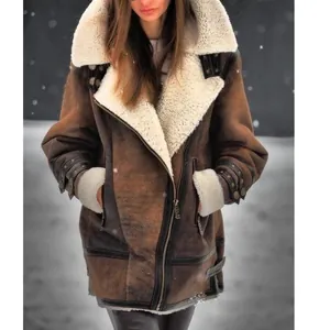 Close-up view of a warm brown suede jacket with white faux fur lining worn outdoors