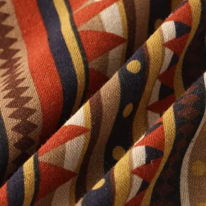 Close-up macro view of high-quality ethnic geometric pattern fabric on bohemian men's shirt