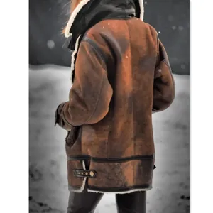 Back view of a warm brown faux shearling jacket with black faux leather trim details
