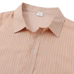 Close-up detail of orange striped men's casual beach shirt collar and white button