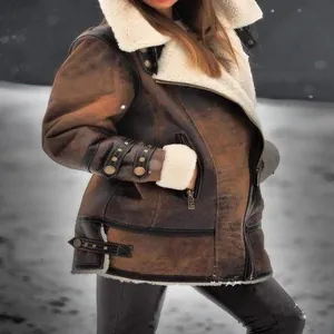 Detailed macro view of the brown faux fur suede jacket for women in a winter scene.