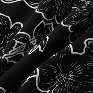 Macro detail of black and white floral print fabric for men's summer short sleeve shirt