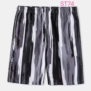 Detail view of men's beach shorts featuring a grey and black brush stroke stripe pattern.