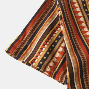 Close-up of ethnic geometric pattern on men's vintage striped casual shirt fabric