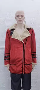 Red faux suede winter jacket with cream faux fur collar and grommet strap details.