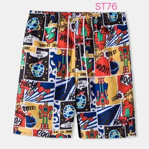 Close-up detail of men's vibrant comic print beach shorts with white drawstring waistband