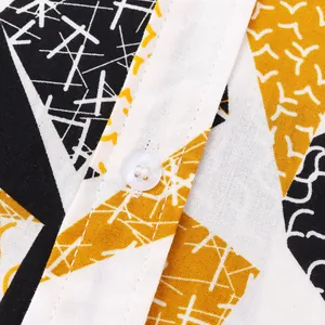 Detailed macro view of geometric pattern and white button on men's cotton shirt