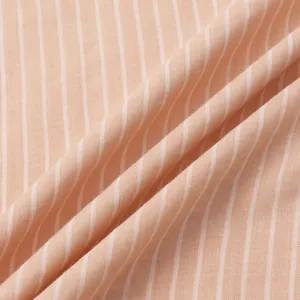 Macro detail of the breathable striped fabric on a men's summer beach shirt