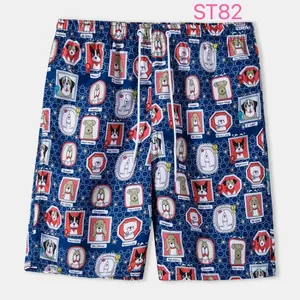 Men's navy blue beach shorts featuring colorful cartoon dog portrait patterns with drawstring waist.