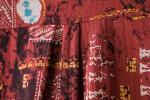 Detailed macro shot of ethnic tribal print and cotton fabric on men's beach shirt