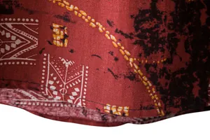 Close-up of vintage print shirt hem showing high-quality fabric texture and stitching.