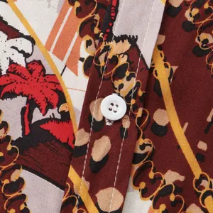 Close-up of vintage tropical print shirt with white button and detailed stitching