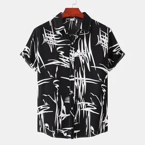 Detail view of black men's short sleeve shirt with white abstract graphic pattern