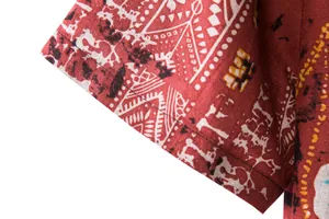 Close-up detail showing the fabric texture of a men's red bohemian print short sleeve shirt