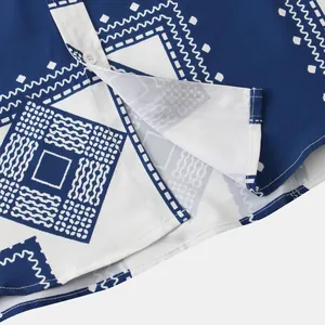 Macro view of the navy blue ethnic geometric pattern and button placket detail