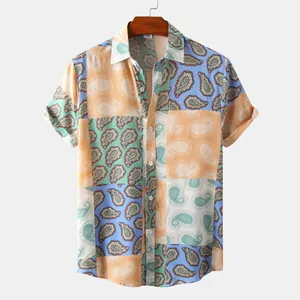 Detailed view of the vibrant paisley patchwork print on a men's short sleeve shirt