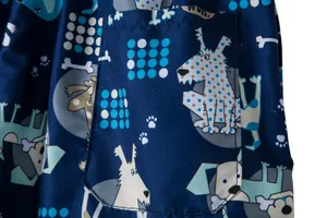 Macro detail of men's swimming trunks featuring a playful cartoon dog print and pocket