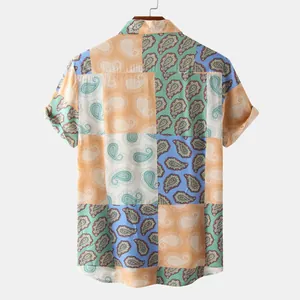 Back view detail of men's short sleeve shirt with colorful paisley patchwork pattern