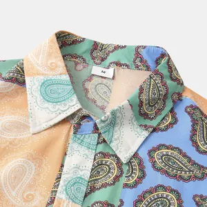 Macro view of men's floral shirt collar showing colorful paisley print and size tag