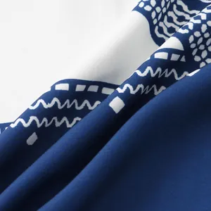 Close-up of blue ethnic pattern fabric for men's casual short sleeve button-down shirt