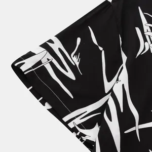Detailed close-up of premium black and white abstract graffiti print on men's shirt