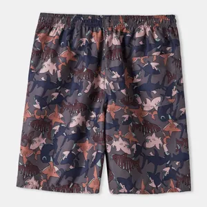 Back view of men's summer beach shorts with cartoon shark print and functional rear pocket.