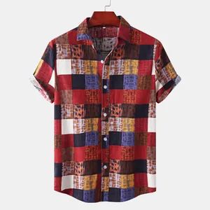 Macro view of the unique red and black patchwork pattern on a men's button-down shirt