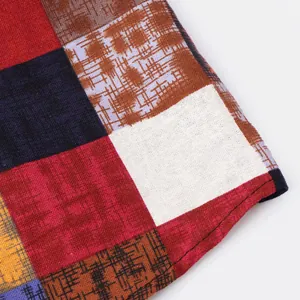 Detailed texture of ethnic patchwork pattern on men's casual linen long sleeve shirt
