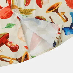 Close-up detail of a colorful mushroom print on a slim fit casual short sleeve shirt