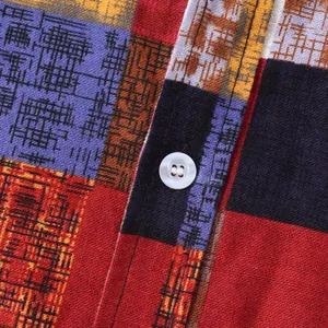 Close-up of ethnic style linen-like fabric with colorful block pattern and button