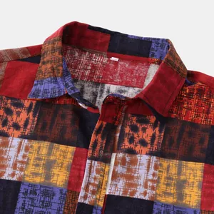 Detailed macro view showing the collar and colorful patchwork fabric of a men's ethnic shirt