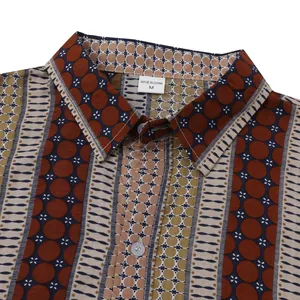 Detailed close-up of a men's Hawaiian beach shirt collar with geometric prints and buttons