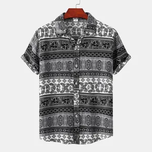 Detailed view of men's short-sleeved shirt with ethnic stripe and elephant pattern