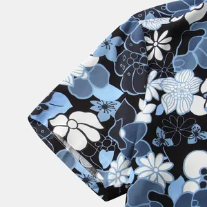 Close-up of the short sleeve on a blue floral print men's Hawaiian shirt.